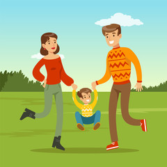 Happy young father and mother spending time with son