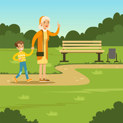 Obraz na płótnie Canvas Happy grandmother spending time with kid in park