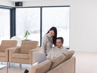 Fototapeta premium multiethnic couple using laptop computers
