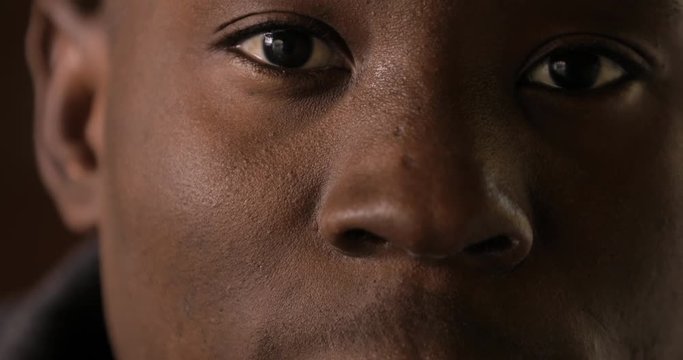 Eyes, lips and nose of african man closeup