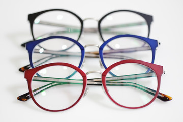 Multicolored glasses on the white background
