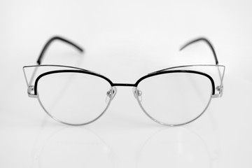 Eye glasses with clear lenses on the white background