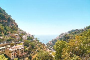 Positano on Sorrento coast with typical Campania province houses and sea on horizon.