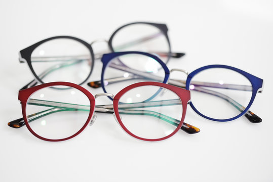 Multicolored glasses on the white background