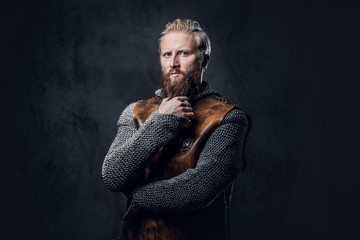 A man Viking dressed in Nordic armor.
