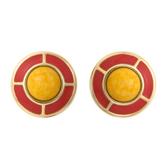 Golden earrings with gemstone isolated on white background