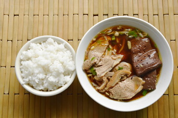 boiled duck meat and blood in brown Chinese herb soup eat couple with rice