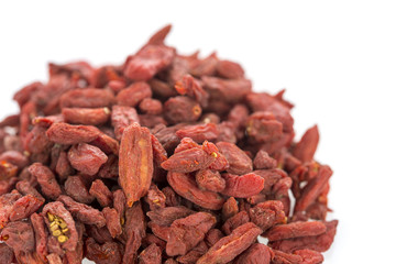 Pile of goji berries on a white background