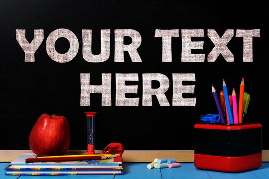 Blank space for text black chalkboard with school accessories