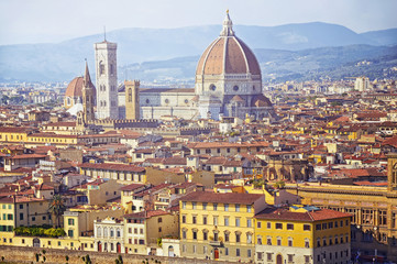 Fototapeta na wymiar Beautiful aerial view of Cathedral Santa Maria Del Fiore with Giotto's Campanile in Florence. Panorama view from Michelangelo park square ,Italy