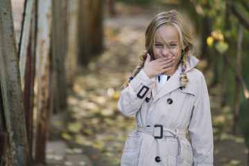 little girl with autumn leaves