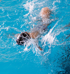 boy on a swim in a sports pool