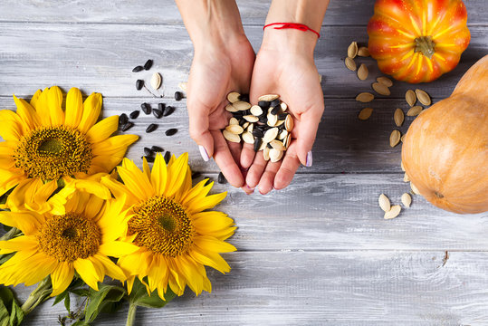 Woman Holding A Handful Of Healthy Seeds