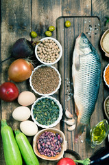 Healthy food ingredients for cooking concept diet fresh raw fish with vegetables and grains