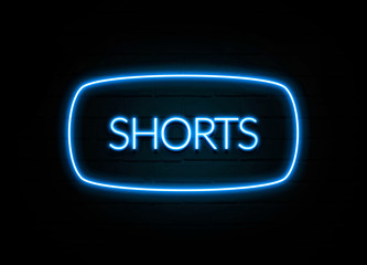 Shorts  - colorful Neon Sign on brickwall