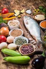 Healthy food ingredients for cooking concept diet fresh raw fish with vegetables and grains