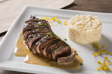 Duck magret with tucupi sauce and jambu risotto.
