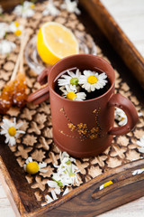 Obraz na płótnie Canvas Cup of chamomile tea