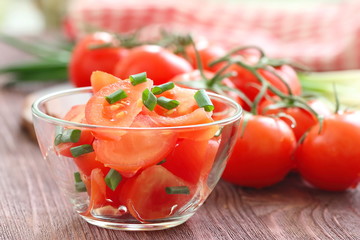 Fresh salad with tomatoes and spring onion