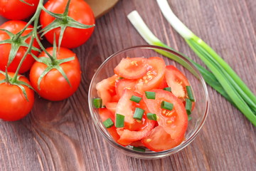 Fresh salad with tomatoes and spring onion