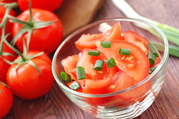 Fresh salad with tomatoes and spring onion