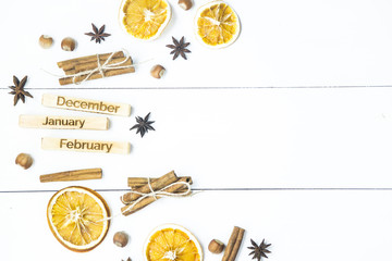 winter still life with the inscriptions of the names of the months - December, January, February among the Christmas products and ornaments. Flat lay. Background. Copyspace