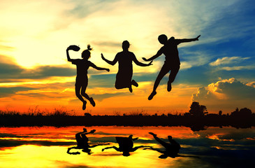 Silhouette of a three girls jumping, look like they can flying. The image decorated the river with a program.