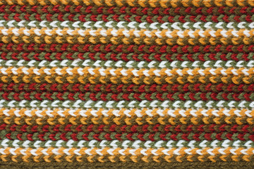 Texture of striped knitting woolen fabric. Christmas background.