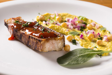 grilled bacon with guava jam, pea salad, watercress and onion.
