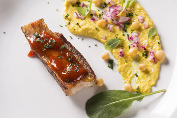 grilled bacon with guava jam, pea salad, watercress and onion.