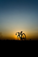 silhouette bicycle on sunset.