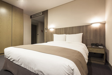 sleeping room with bed, pillow, blanket at the hotel in seoul