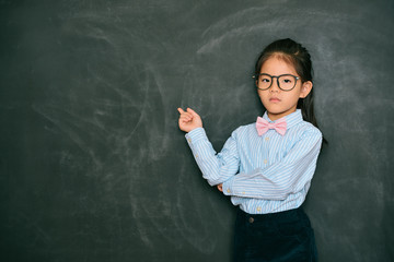 angry pretty little teacher pointing blackboard