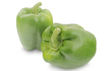 Two green peppers isolated on white background 