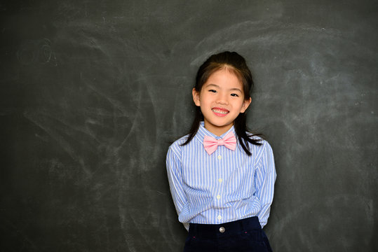 pretty little girl kid dress up as school teacher