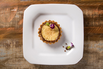 corn cheese cake with hazelnut cream in a white plate.