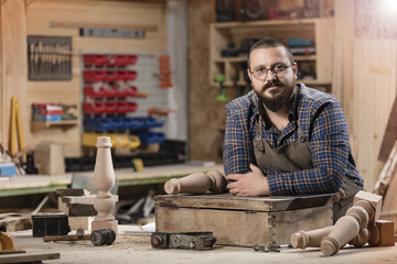 Wood designer working in workshop.