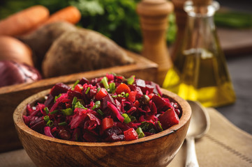 Vegetable salad with beetroot, carrot, pea and onion. Russian style cuisine.