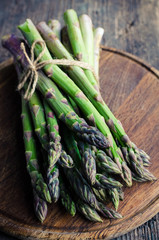 Bunch of asparagus on wooden board