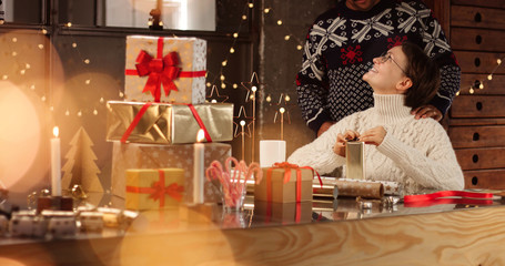 mixed race family wrapping Christmas presents