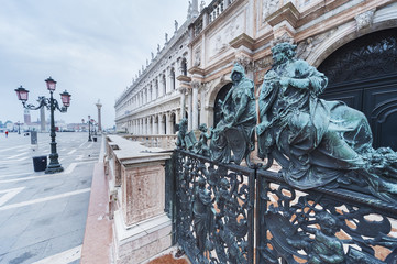 Fototapeta premium Decorative metal gate ornament. Antique iron door with classic ornaments of Campanile in Doge's palace, Venice, Italy