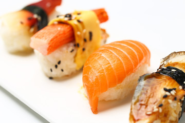 assorted sushi on white plate isolated on white back ground
