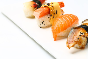 assorted sushi on white plate isolated on white back ground