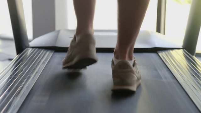 Exercising in the gym, treadmill cardio workout