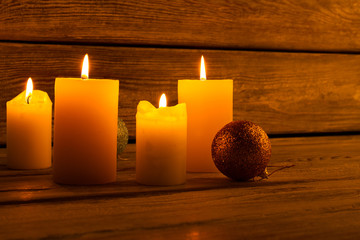 Lighted candles and sparkling baubles