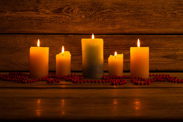 Lit candles and bead garland