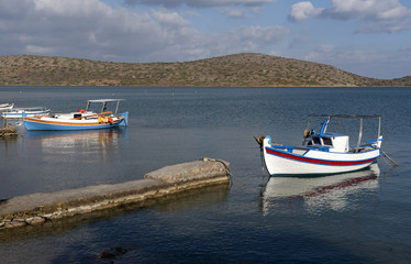 Fototapeta premium Small boat on the Merabello Gulf at Elounda, northern Crete, Greece,