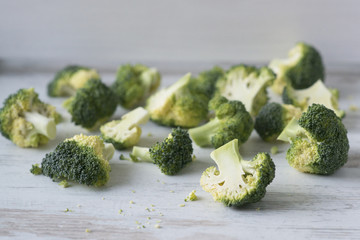 broccoli on white wooden background