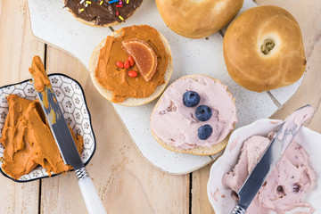 Fresh mini bagels with pumpkin spice and strawberry cream cheese.