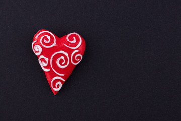 Red Heart on black paper